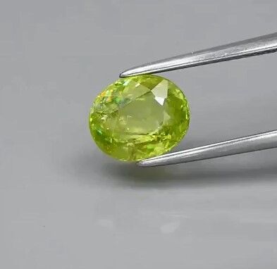 2.10ct 7.7x6.5mm Oval Natural Yellowish Green Sphene Madagascar, High Luster