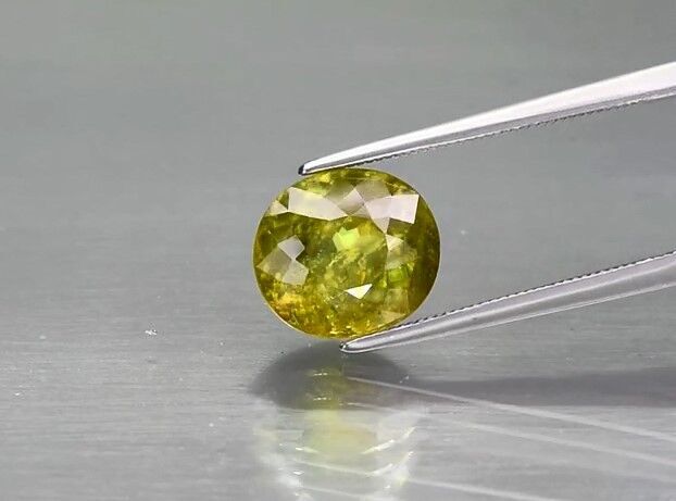 4.19ct 10x9mm Oval Natural Yellowish Green Sphene Madagascar, Adamantine Luster