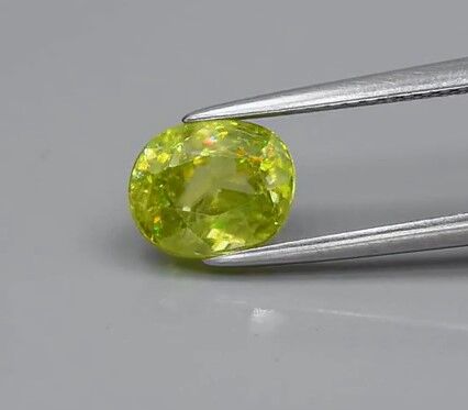 1.88ct 7.8x6.3mm Oval Natural Yellowish Green Sphene Madagascar, Diamond Luster